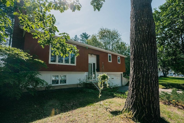 41 Curtis Ln, Milford, ME 04461 - back of property featuring asphalt driveway