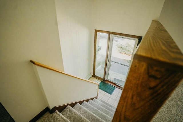 41 Curtis Ln, Milford, ME 04461 - staircase with a baseboard heating unit and tile patterned floors