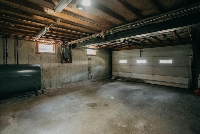 41 Curtis Ln, Milford, ME 04461 - garage with oil tank and electric panel