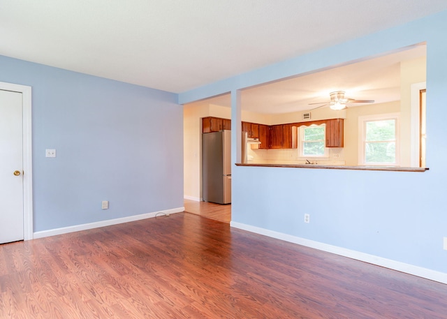 919 College St, Lewiston, ME 04240 - unfurnished living room featuring ceiling fan and wood finished floors