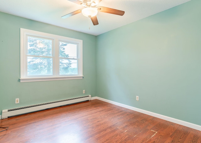 919 College St, Lewiston, ME 04240 - spare room featuring a baseboard radiator, wood finished floors, and a ceiling fan