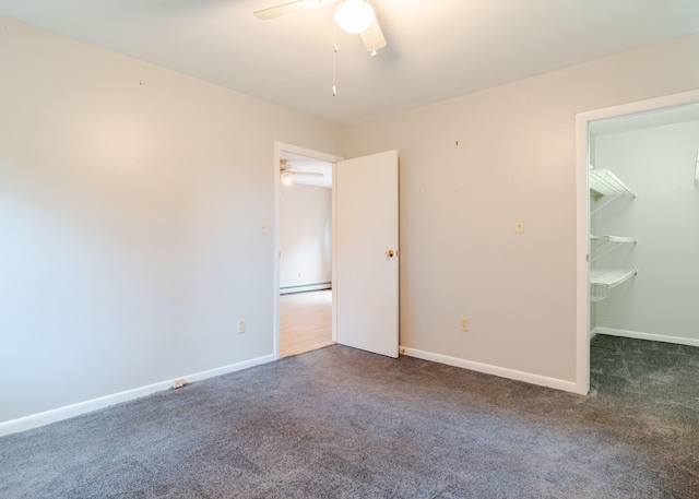 919 College St, Lewiston, ME 04240 - unfurnished bedroom featuring carpet flooring, ceiling fan, a spacious closet, and a baseboard radiator