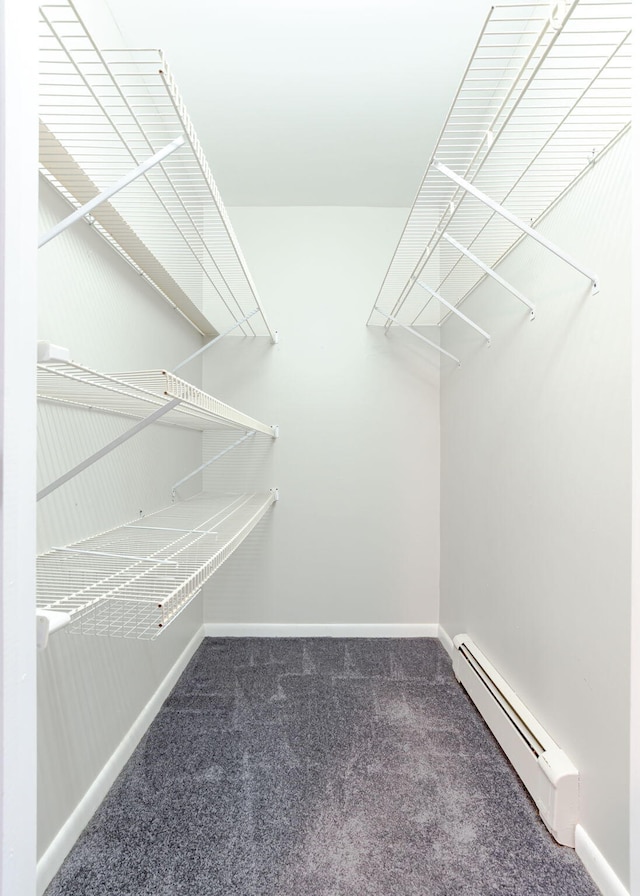 919 College St, Lewiston, ME 04240 - walk in closet featuring baseboard heating and carpet floors