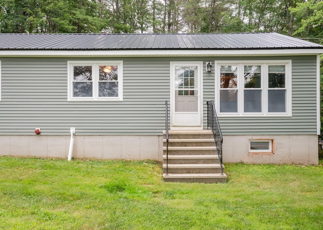 919 College St, Lewiston, ME 04240 - view of front facade with a front lawn and a metal roof