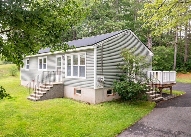 919 College St, Lewiston, ME 04240 - view of front of property with a front lawn, a metal roof, and a deck