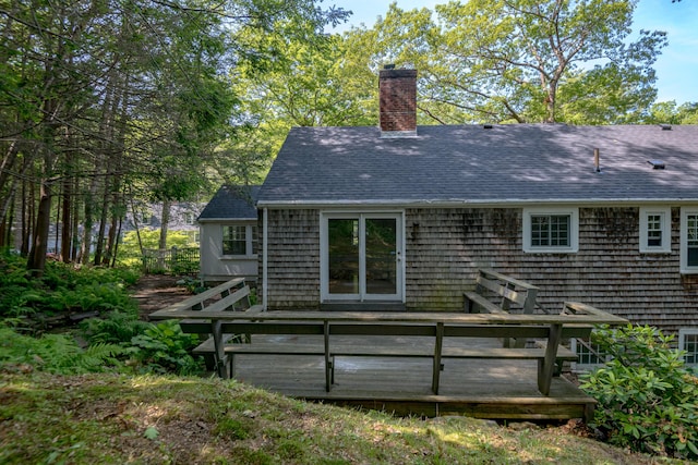 24 Littlejohn Rd, Cape Elizabeth, ME 04107 - rear view of property featuring roof with shingles, a wooden deck, and a chimney