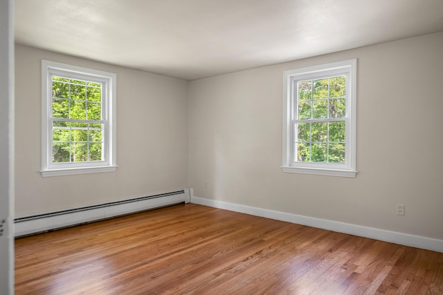 24 Littlejohn Rd, Cape Elizabeth, ME 04107 - spare room featuring baseboard heating and light wood finished floors