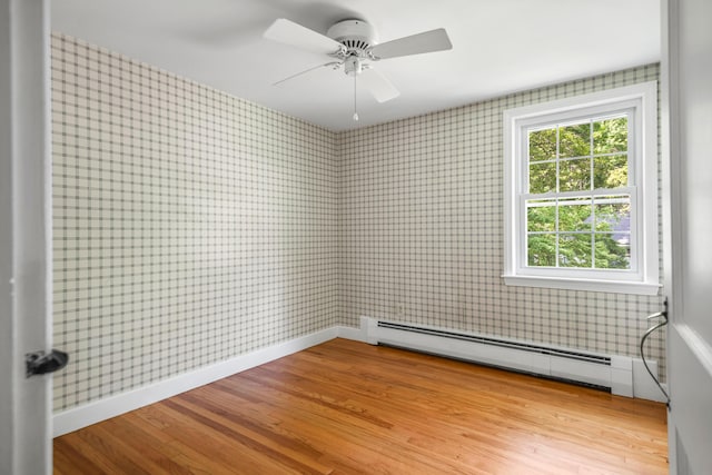 24 Littlejohn Rd, Cape Elizabeth, ME 04107 - spare room with a baseboard heating unit, light wood-type flooring, wallpapered walls, and a ceiling fan