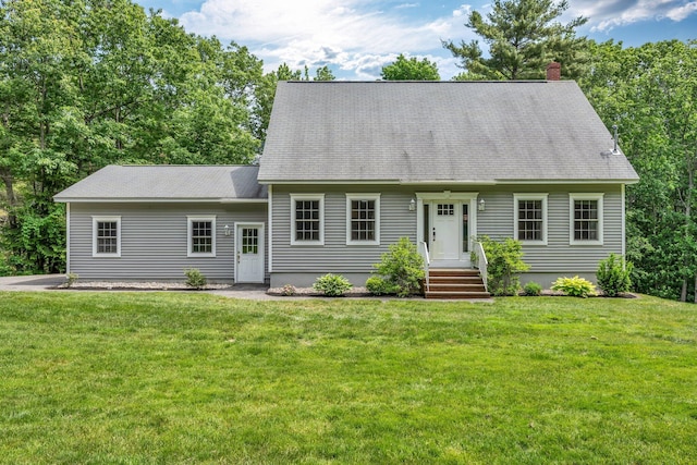 31 Pond Ridge Dr, Lewiston, ME 04240 - cape cod home featuring a chimney, a front lawn, and a shingled roof