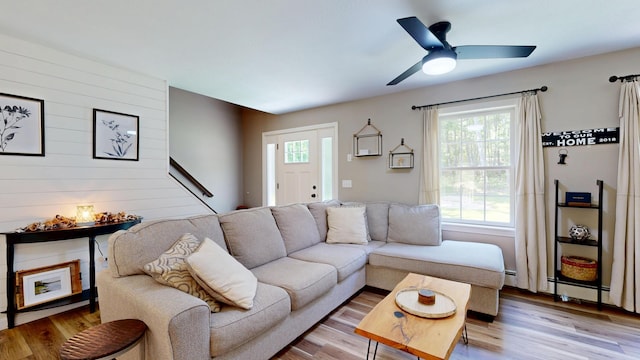 31 Pond Ridge Dr, Lewiston, ME 04240 - living area with light wood finished floors and a ceiling fan