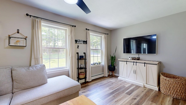 31 Pond Ridge Dr, Lewiston, ME 04240 - living area featuring a ceiling fan and light wood-style floors