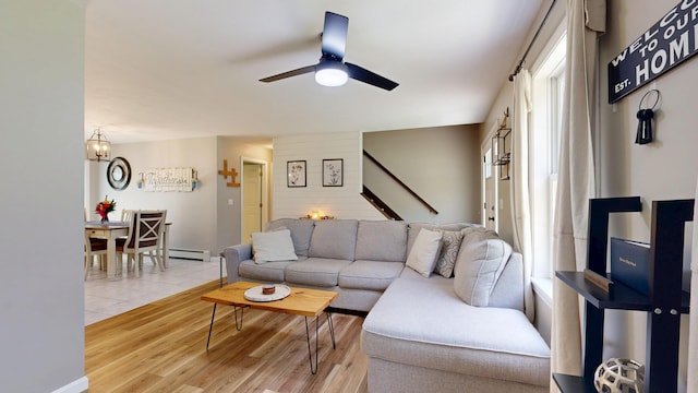 31 Pond Ridge Dr, Lewiston, ME 04240 - living area featuring stairs, ceiling fan, light wood-style floors, and a baseboard heating unit