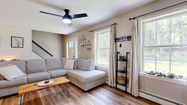 31 Pond Ridge Dr, Lewiston, ME 04240 - living area with a ceiling fan and light wood-style flooring