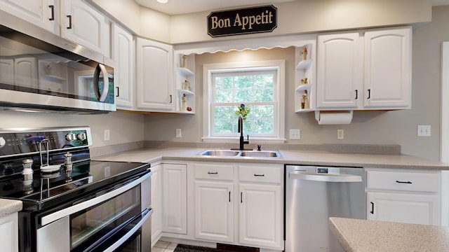 31 Pond Ridge Dr, Lewiston, ME 04240 - kitchen featuring stainless steel appliances, white cabinetry, and light countertops