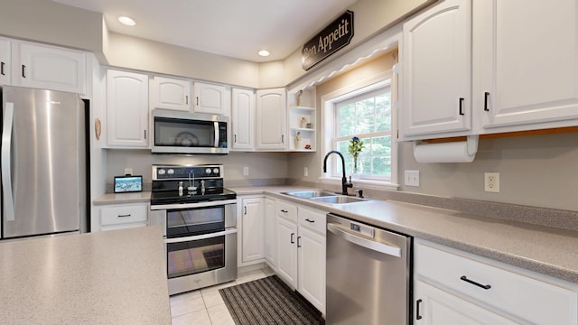 31 Pond Ridge Dr, Lewiston, ME 04240 - kitchen with stainless steel appliances, white cabinets, light countertops, and recessed lighting
