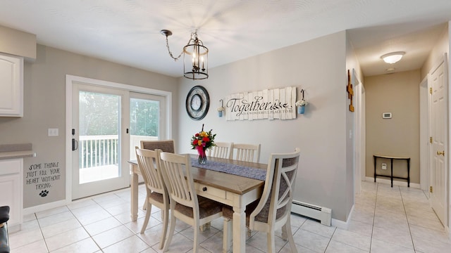 31 Pond Ridge Dr, Lewiston, ME 04240 - dining space featuring a baseboard heating unit and light tile patterned floors