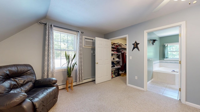 31 Pond Ridge Dr, Lewiston, ME 04240 - sitting room featuring carpet floors, an AC wall unit, lofted ceiling, a baseboard radiator, and ceiling fan