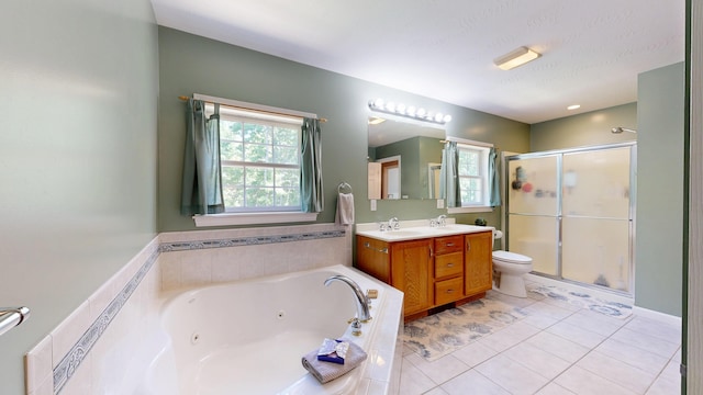 31 Pond Ridge Dr, Lewiston, ME 04240 - full bath featuring a stall shower, double vanity, a whirlpool tub, and healthy amount of natural light