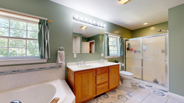 31 Pond Ridge Dr, Lewiston, ME 04240 - full bath featuring a shower stall, tile patterned floors, double vanity, and a bath