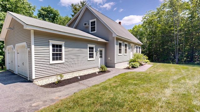 31 Pond Ridge Dr, Lewiston, ME 04240 - view of front of house featuring a garage and a front lawn