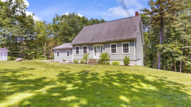31 Pond Ridge Dr, Lewiston, ME 04240 - new england style home with a chimney, a front lawn, and roof with shingles