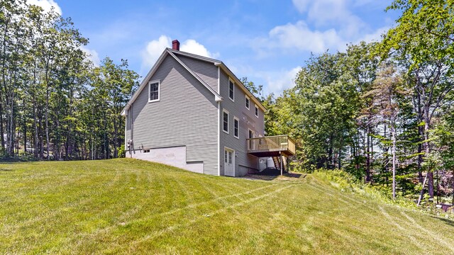 31 Pond Ridge Dr, Lewiston, ME 04240 - view of home's exterior with a chimney, a deck, and a lawn