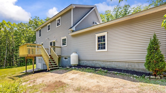 31 Pond Ridge Dr, Lewiston, ME 04240 - back of house with a wooden deck and stairway