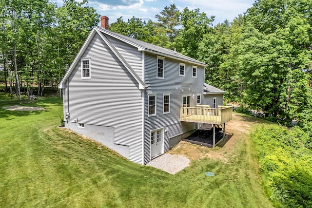 31 Pond Ridge Dr, Lewiston, ME 04240 - rear view of house with a yard, a wooden deck, and a chimney