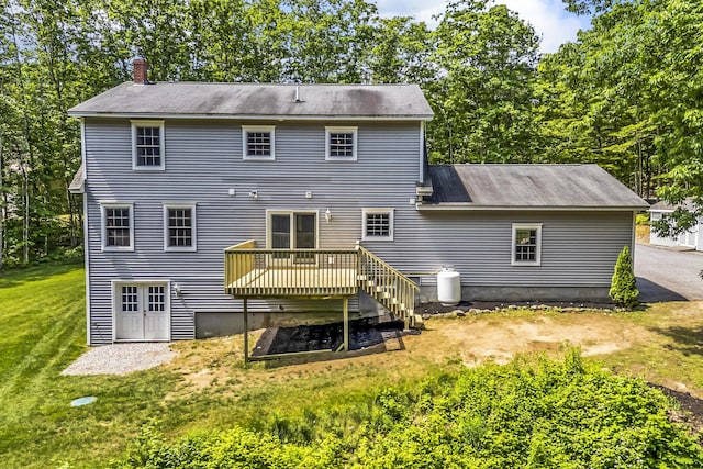 31 Pond Ridge Dr, Lewiston, ME 04240 - back of house featuring a chimney, a wooden deck, and a lawn