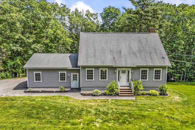 31 Pond Ridge Dr, Lewiston, ME 04240 - cape cod house featuring a front yard, roof with shingles, and a chimney
