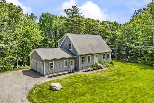 31 Pond Ridge Dr, Lewiston, ME 04240 - view of front facade with roof with shingles, driveway, a front lawn, a chimney, and a garage