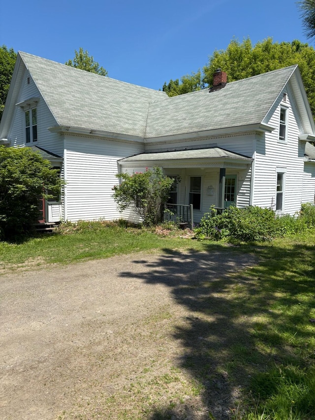 18 Clark St, Calais, ME 04619 - view of front of home with a chimney and a porch