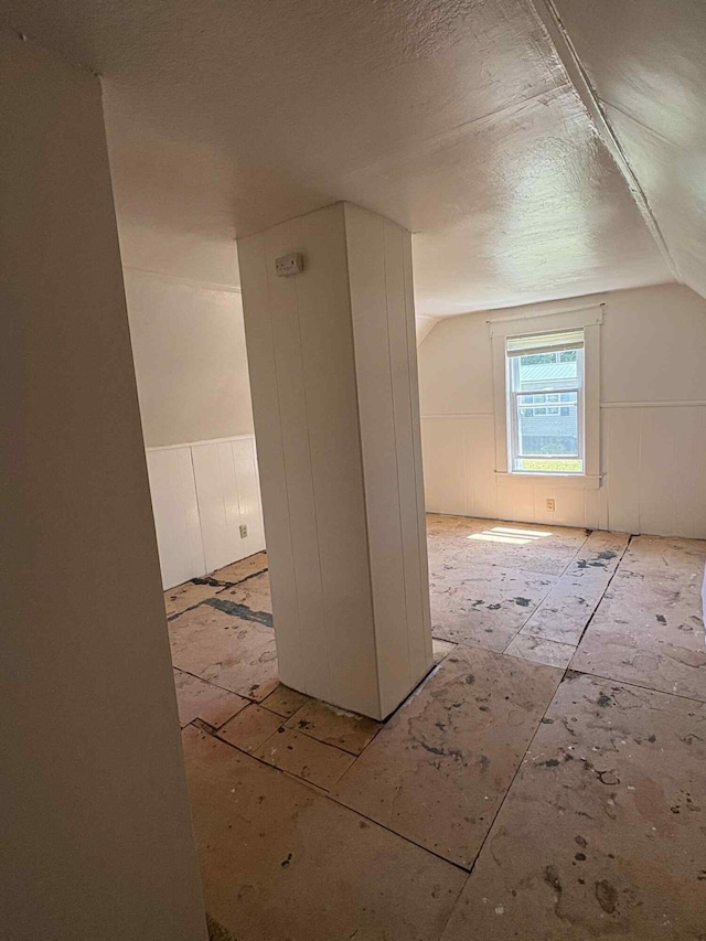 18 Clark St, Calais, ME 04619 - additional living space with lofted ceiling and a textured ceiling