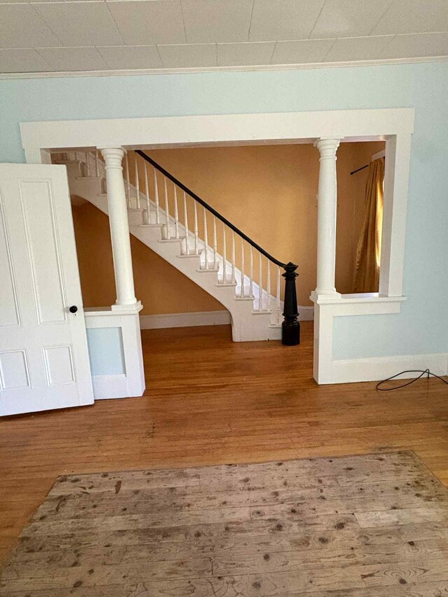 18 Clark St, Calais, ME 04619 - stairway featuring wood finished floors and ornamental molding