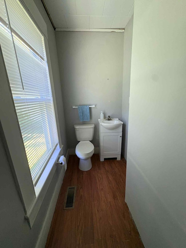 18 Clark St, Calais, ME 04619 - bathroom featuring wood finished floors, healthy amount of natural light, and vanity