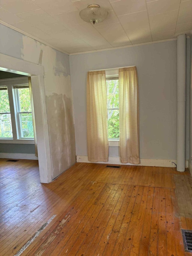 18 Clark St, Calais, ME 04619 - unfurnished room featuring light wood-style flooring and crown molding