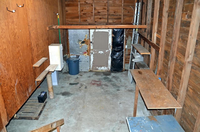 10 Stevens St, Norway, ME 04268 - miscellaneous room with unfinished concrete floors and wood walls