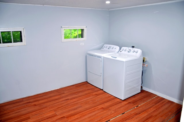 10 Stevens St, Norway, ME 04268 - washroom with washer and clothes dryer, light wood-style flooring, and recessed lighting
