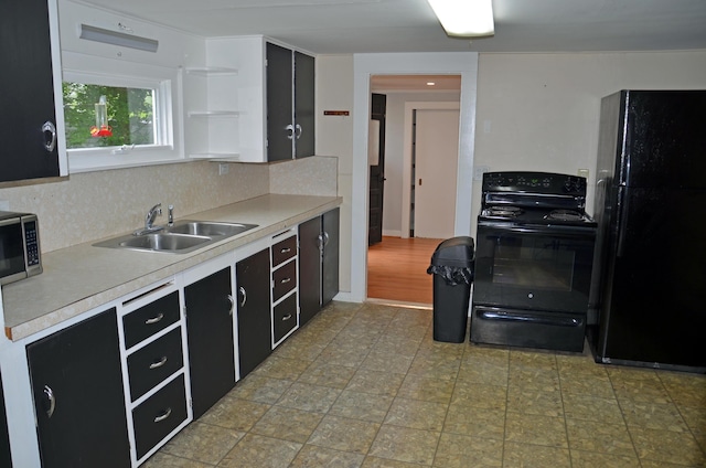 10 Stevens St, Norway, ME 04268 - kitchen featuring black appliances, dark cabinetry, open shelves, and tasteful backsplash