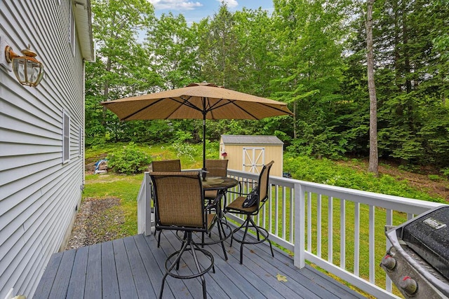 19 Fox Run Rd, Gray, ME 04039 - wooden terrace with outdoor dining space, a storage shed, a grill, and a lawn