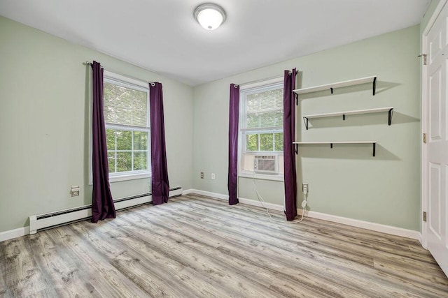 19 Fox Run Rd, Gray, ME 04039 - unfurnished bedroom with wood finished floors, multiple windows, a baseboard radiator, and cooling unit