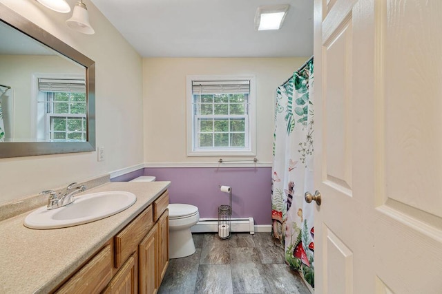 19 Fox Run Rd, Gray, ME 04039 - full bath featuring a baseboard heating unit, vanity, wood finished floors, and a shower with curtain