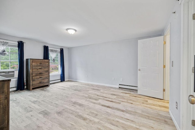 19 Fox Run Rd, Gray, ME 04039 - unfurnished bedroom featuring a baseboard radiator, wood finished floors, a baseboard heating unit, and cooling unit