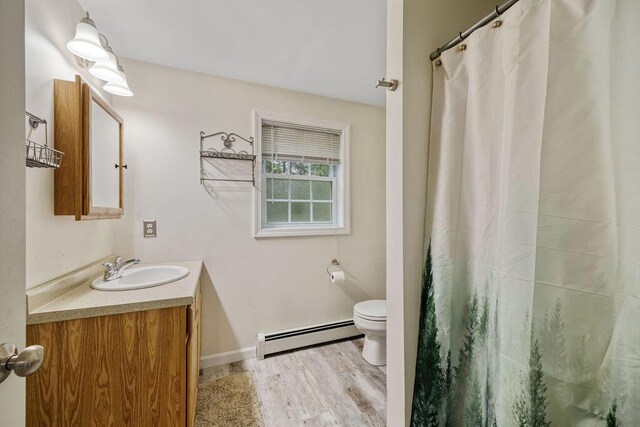 19 Fox Run Rd, Gray, ME 04039 - bathroom featuring a baseboard heating unit, vanity, wood finished floors, and a shower with curtain