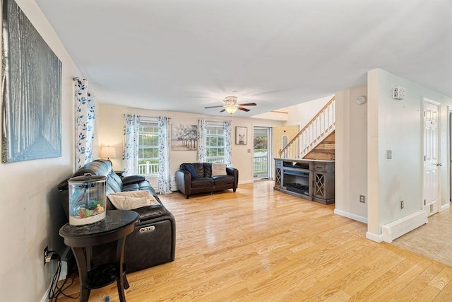 19 Fox Run Rd, Gray, ME 04039 - living area featuring wood finished floors, ceiling fan, and stairway
