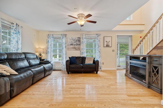 19 Fox Run Rd, Gray, ME 04039 - living room with light wood-style flooring, stairway, plenty of natural light, and a ceiling fan