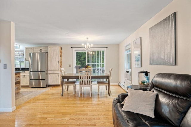 19 Fox Run Rd, Gray, ME 04039 - dining space featuring a chandelier, light wood-type flooring, and a baseboard radiator