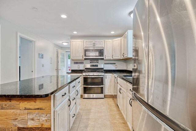 19 Fox Run Rd, Gray, ME 04039 - kitchen featuring appliances with stainless steel finishes, light tile patterned floors, recessed lighting, and dark stone countertops