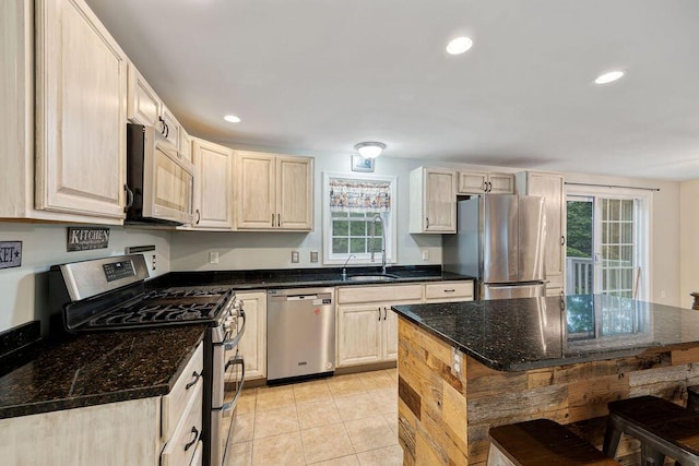 19 Fox Run Rd, Gray, ME 04039 - kitchen featuring stainless steel appliances, recessed lighting, light tile patterned flooring, dark stone counters, and light brown cabinets