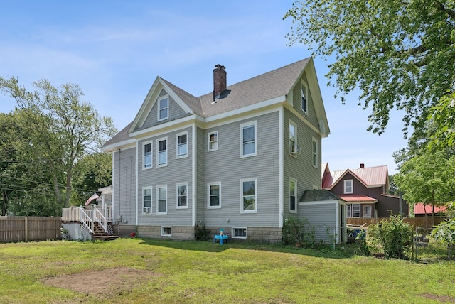 93 Chapel St, South Portland, ME 04106 - rear view of property with a chimney and roof with shingles